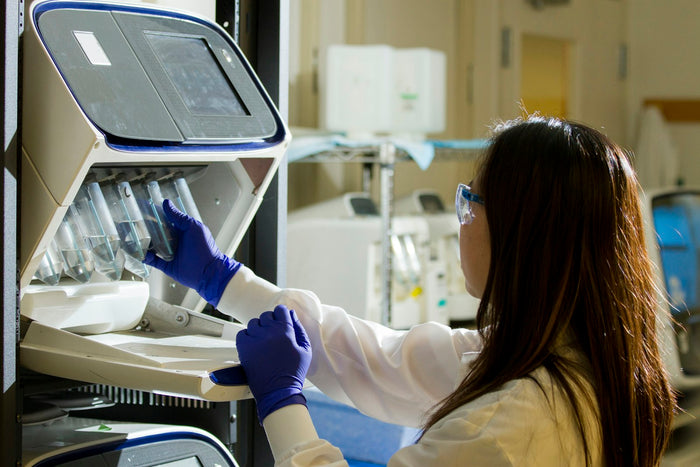 A technician working at a laboratory bench