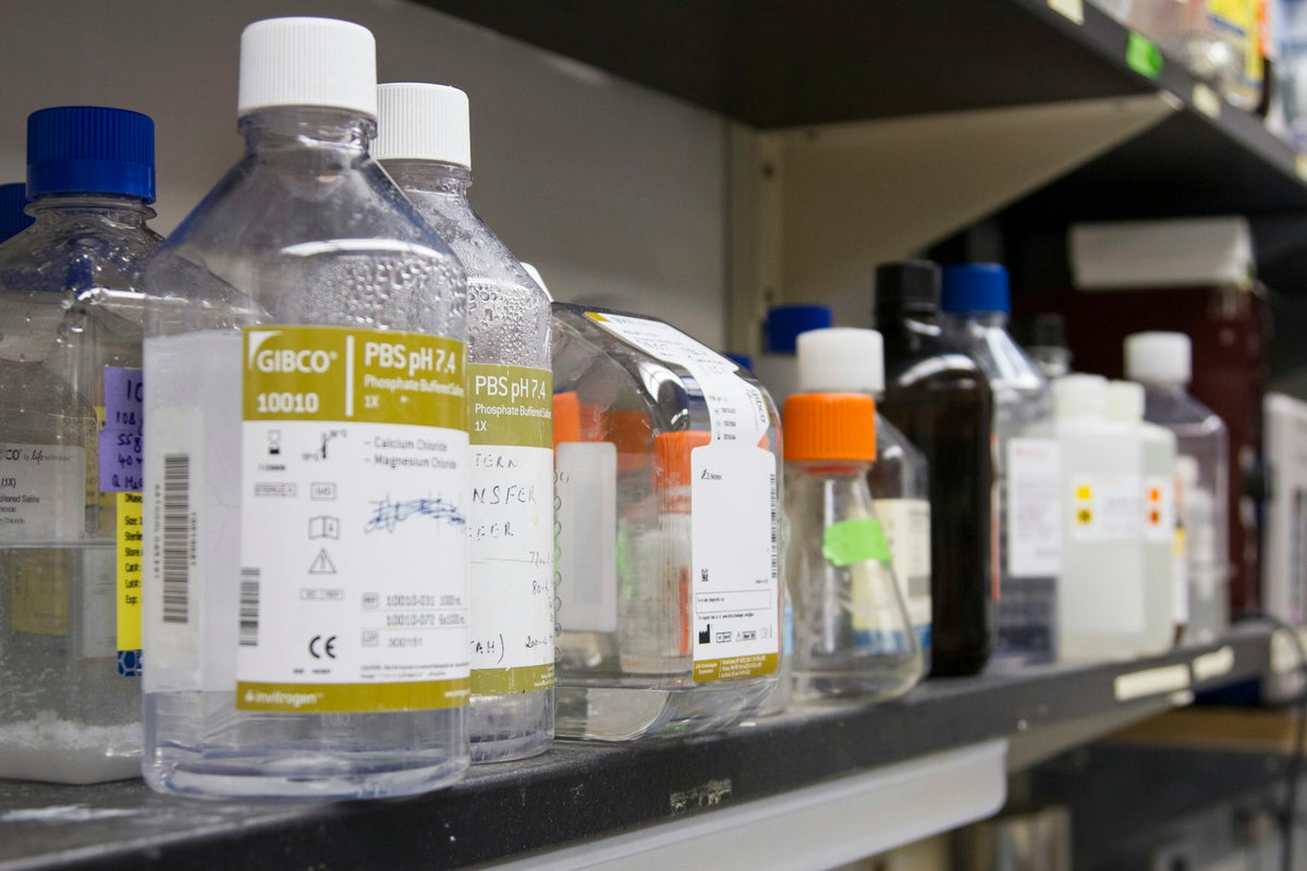 Reagent bottles on a laboratory shelf