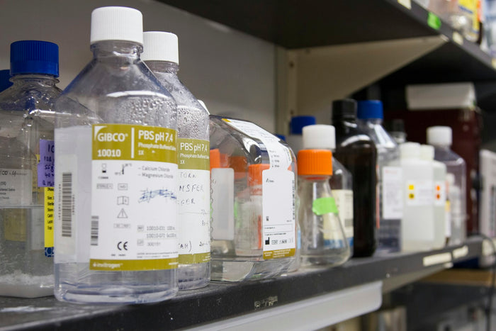 Reagent bottles on a laboratory shelf