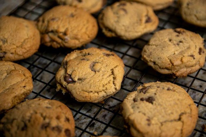 Chocolate chip cookies cooling on a rack