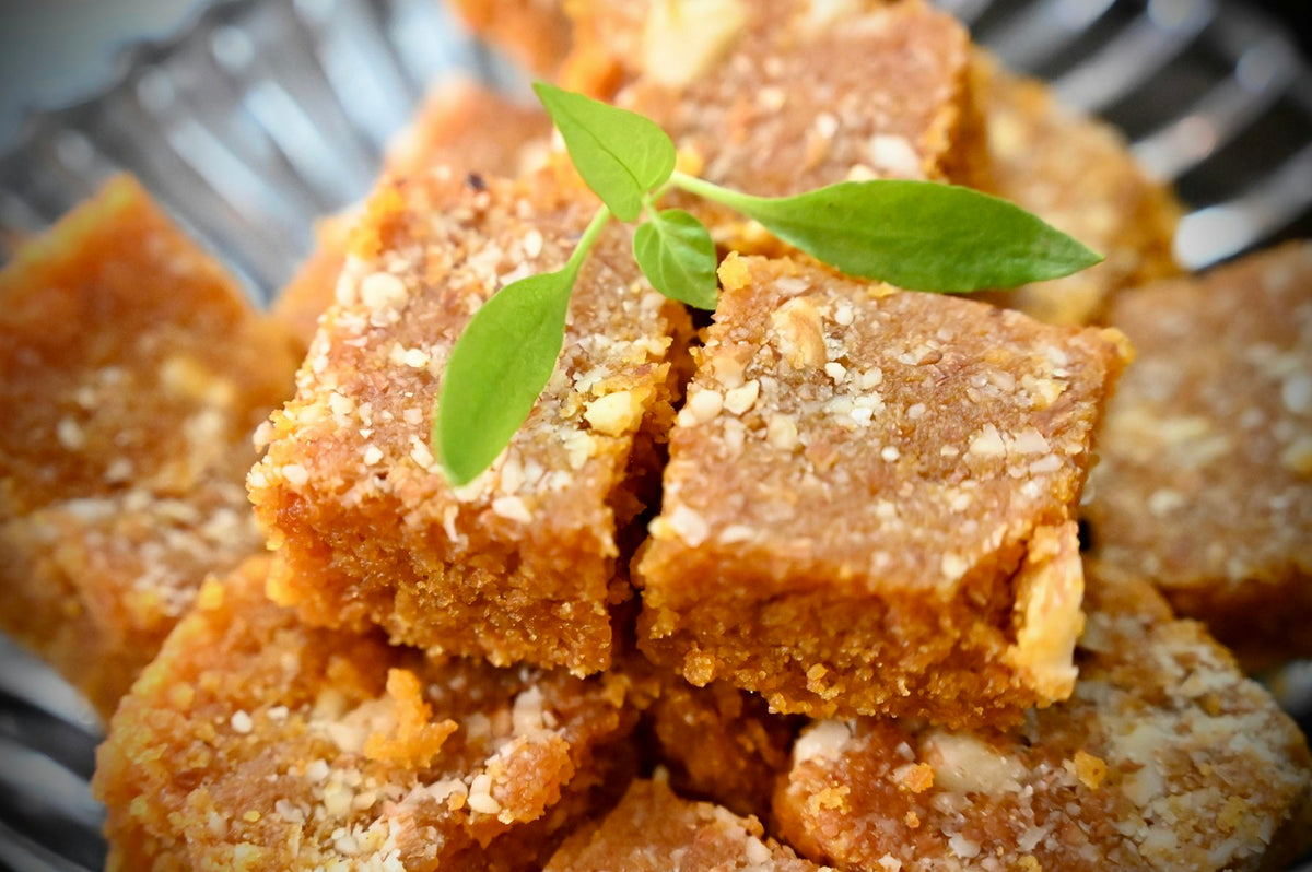 Squares of halwa topped with nuts