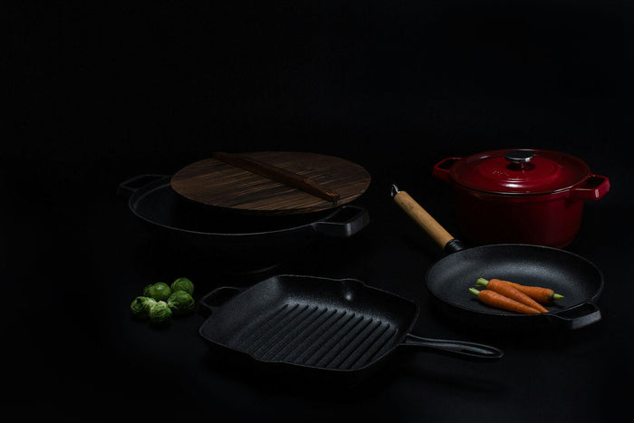 Cast iron pans on a dark table