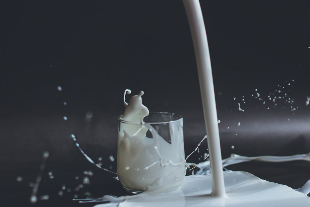 Milk splashing as it is poured into a glass