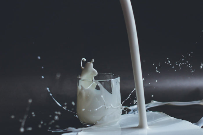 Milk splashing as it is poured into a glass