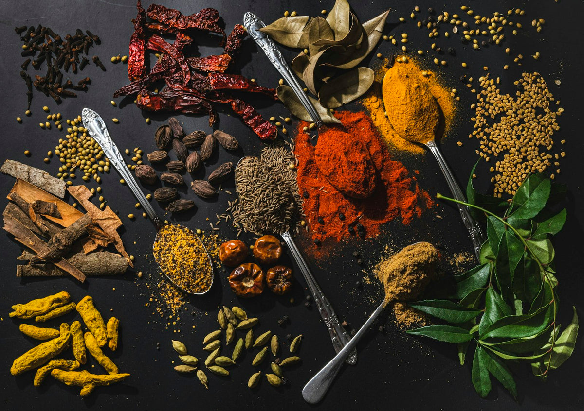 Whole spices and ground spices on spoons