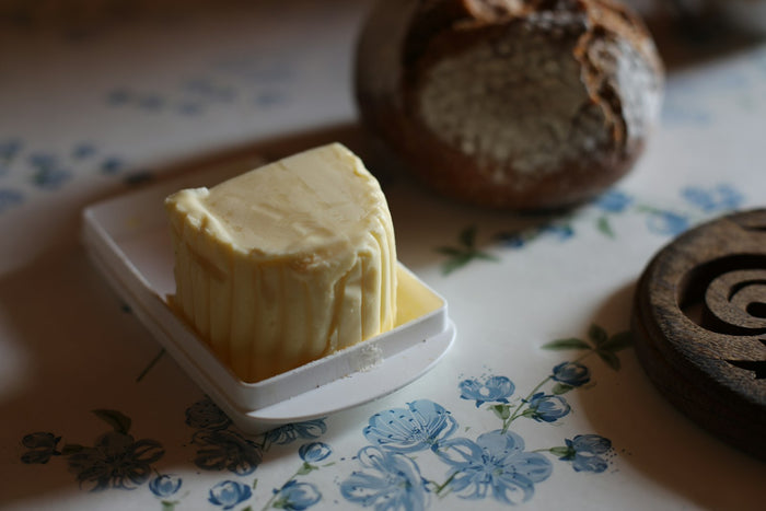A block of butter on a butter dish