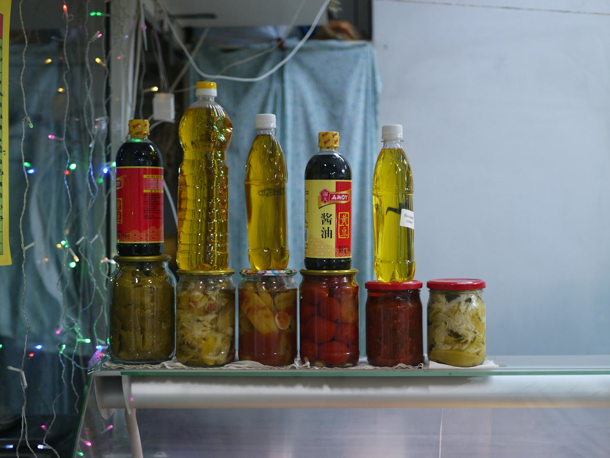 Jars and bottles of oil on a shelf