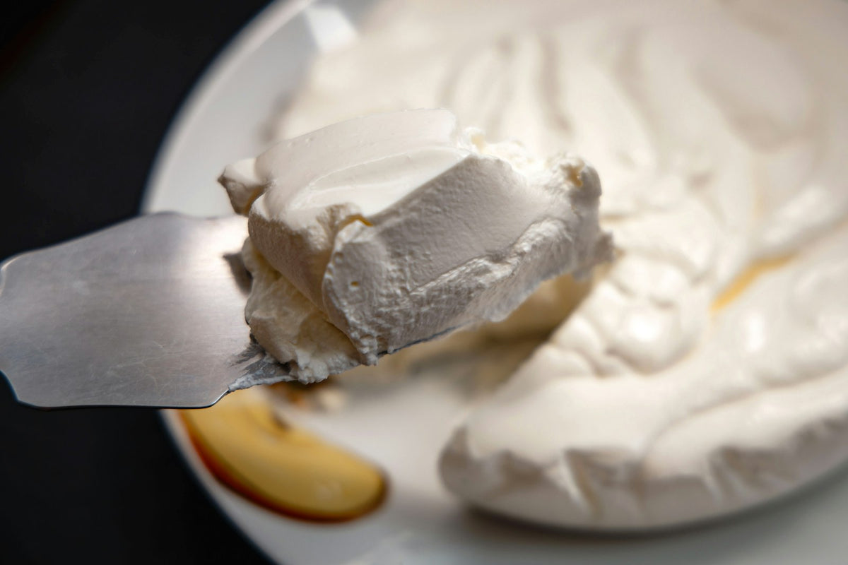 A dollop of thick cream on a plate