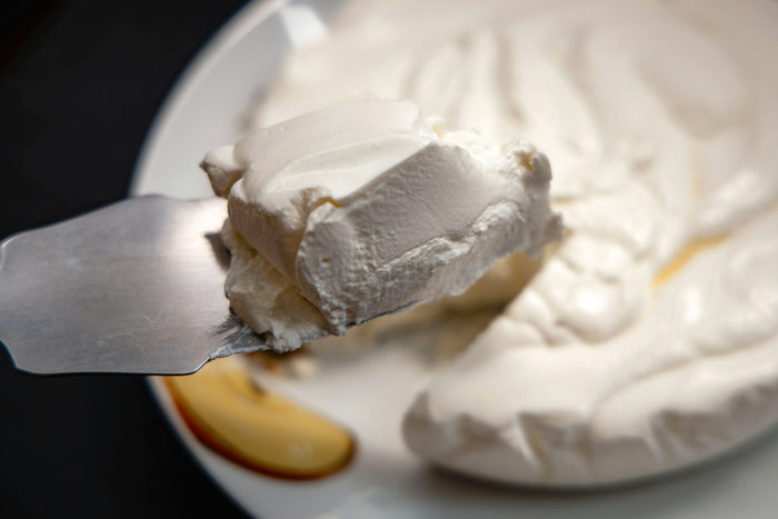A dollop of thick cream on a plate