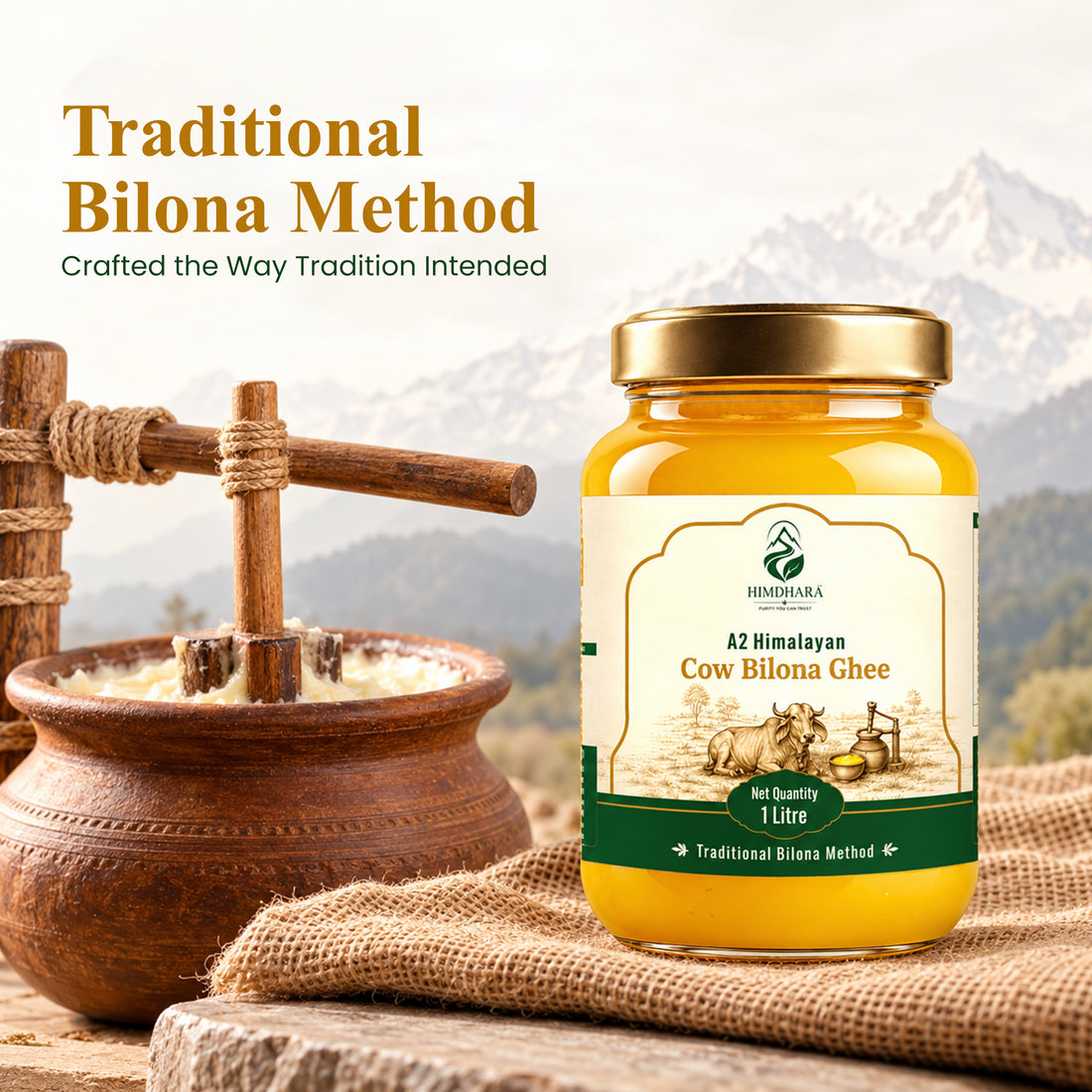 Traditional bilona method: a wooden hand churner in a clay pot of curd beside a jar of Himdhara A2 Cow Bilona Ghee
