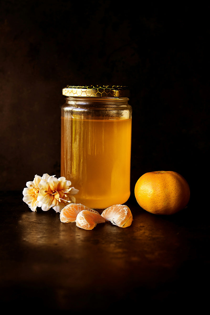 Honey settling in a glass jar